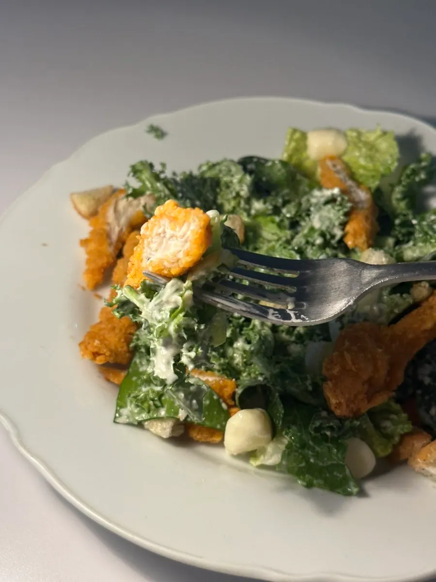 Vegetables tossed in Caesar dressing with chicken tenders