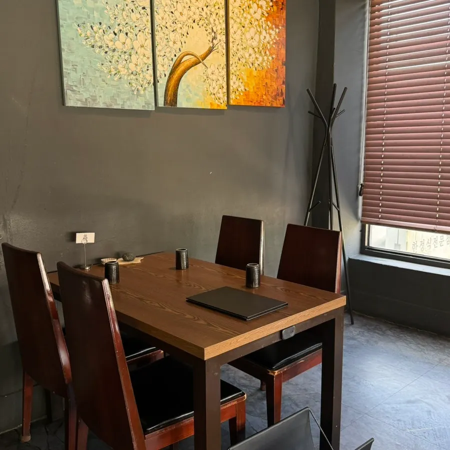 Bunko Dining's dining hall with black-and-wood interior