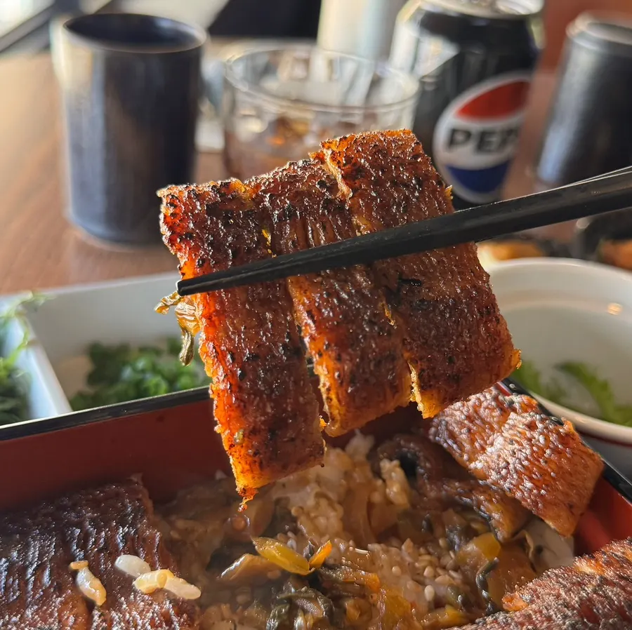Plump grilled eel flesh brushed with sauce