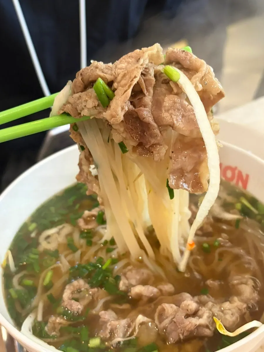 Close-up of the Kkamon pho broth and noodles