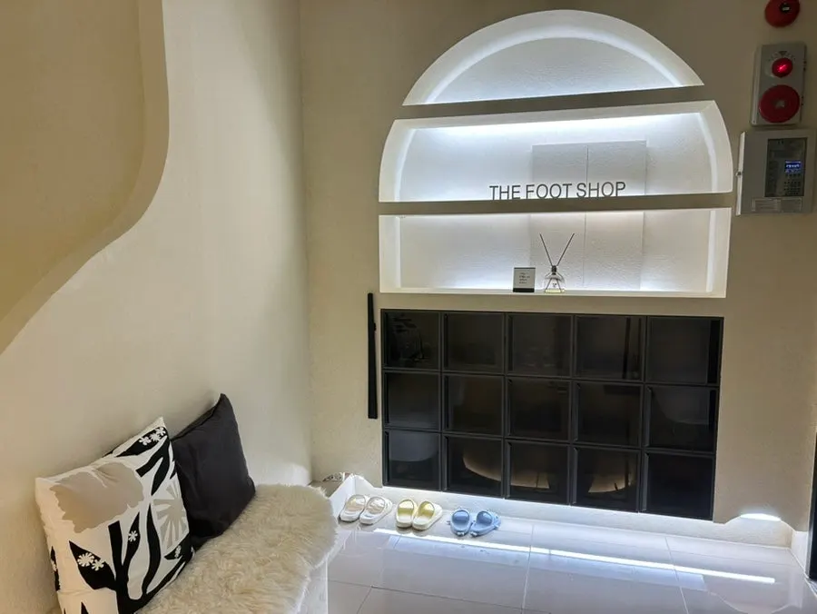 Shoe cabinet hidden behind dark glass