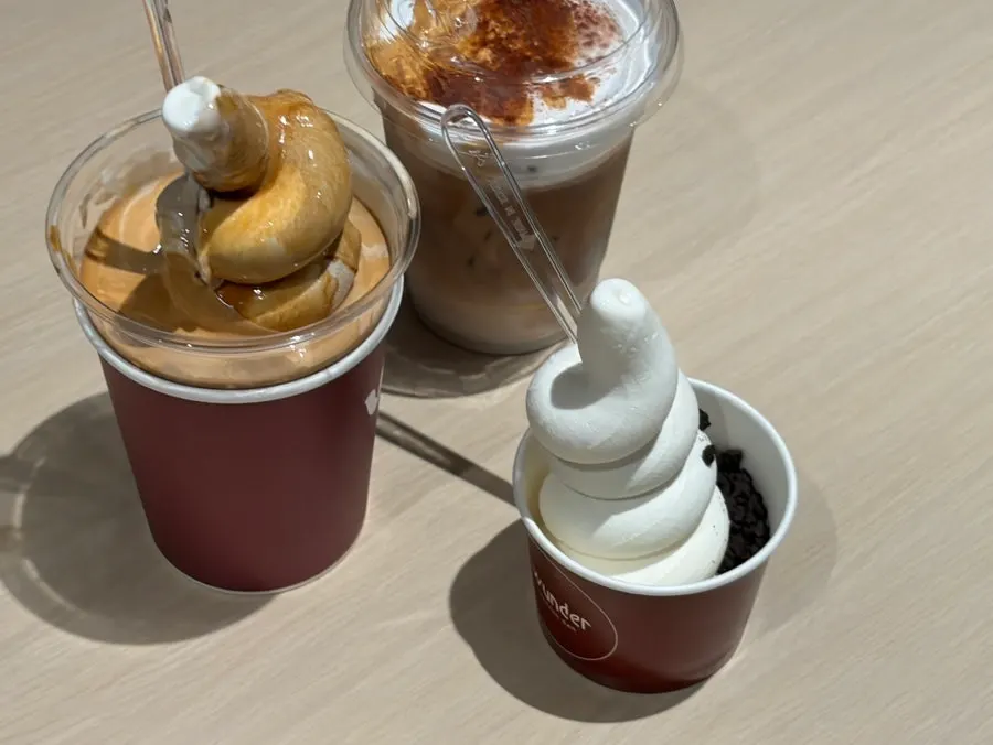 Table with Wunder Gato, soft ice cream cup, and Wunder Coffee together
