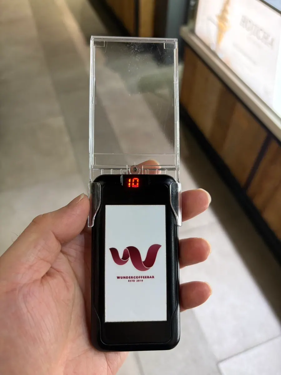 Buzzer placed on a table at Wunder Coffee Bar