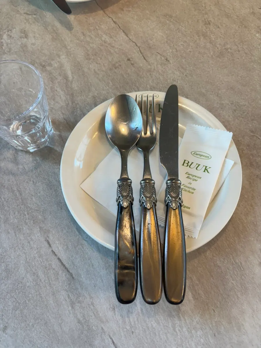 Table setting with tableware and water bottle