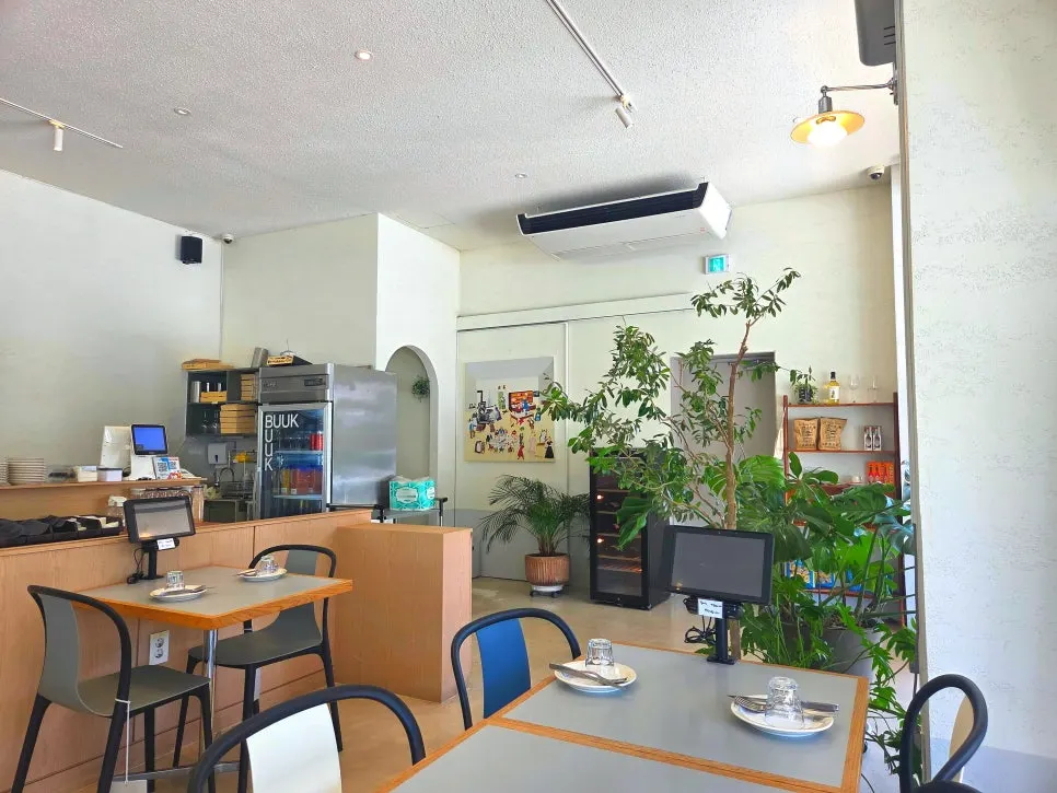 Bright, clean interior with plants throughout