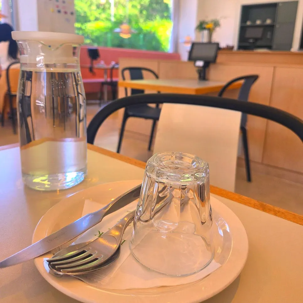 Table pre-set with water and cutlery