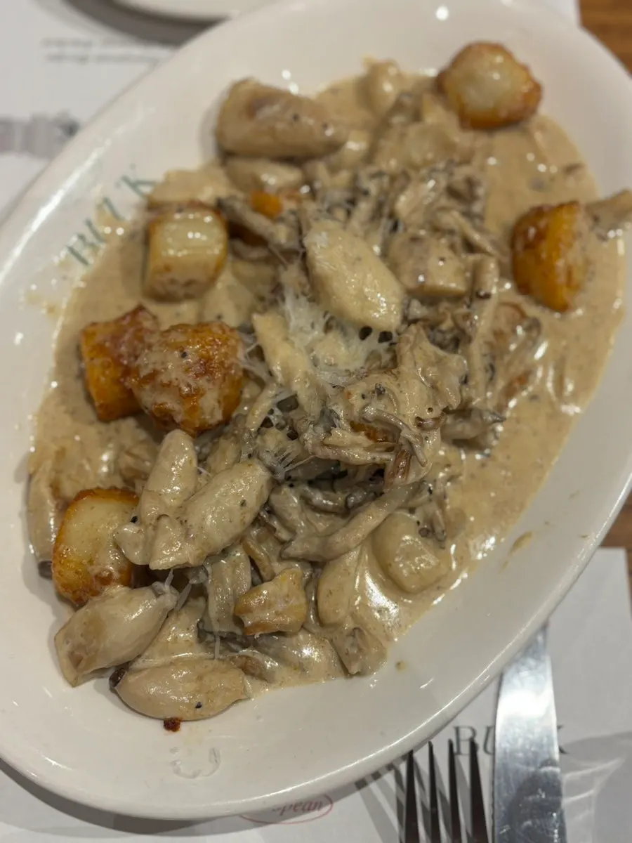 A plate of truffle mushroom cream gnocchi