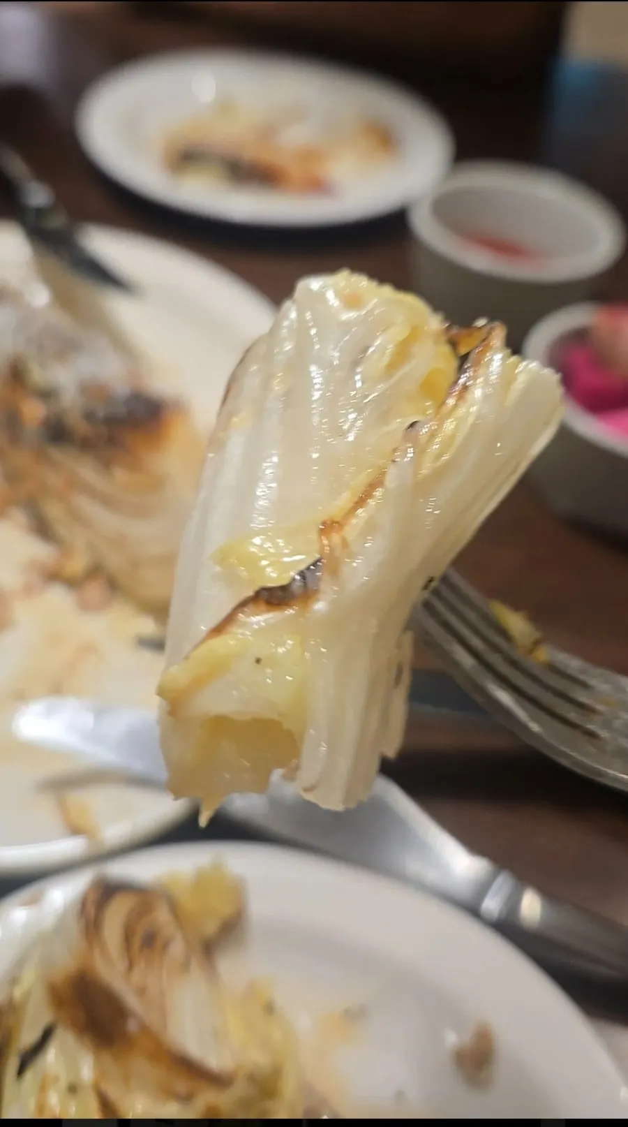 Cross-section of the grilled napa cabbage showing a moist interior