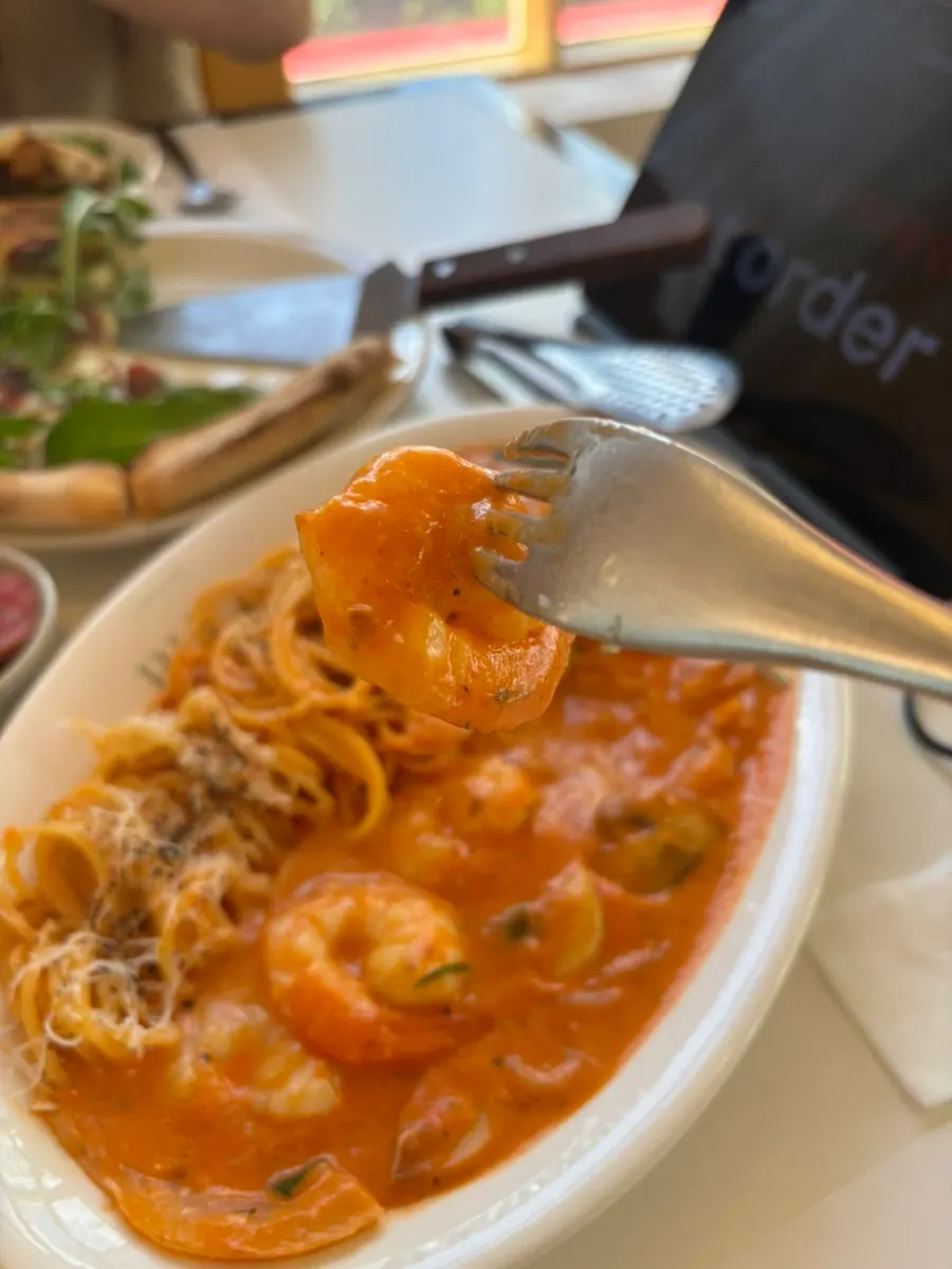 Close-up of shrimp rosé pasta with shrimp on top
