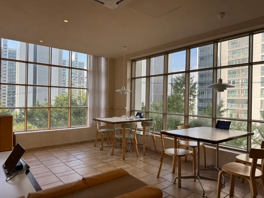 Bueokgan's signature semicircle table with a view through the window