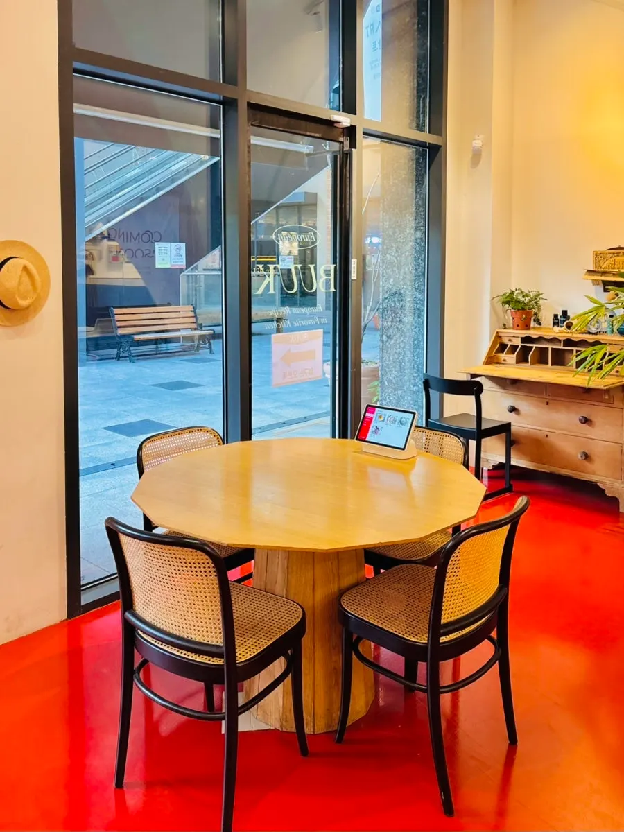 White-toned interior of Bueokgan Restaurant with its arched ceiling