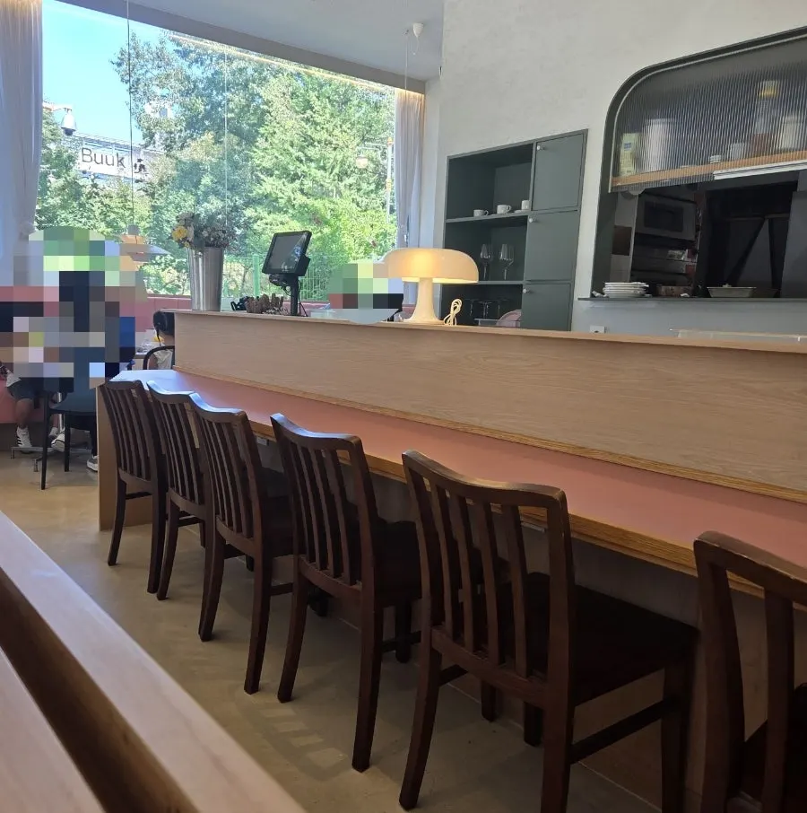 Bar table seating facing the kitchen