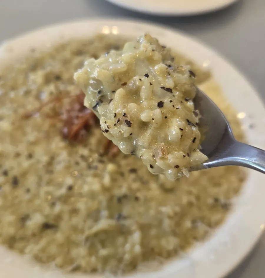 Abalone cream risotto topped with fried enoki mushroom