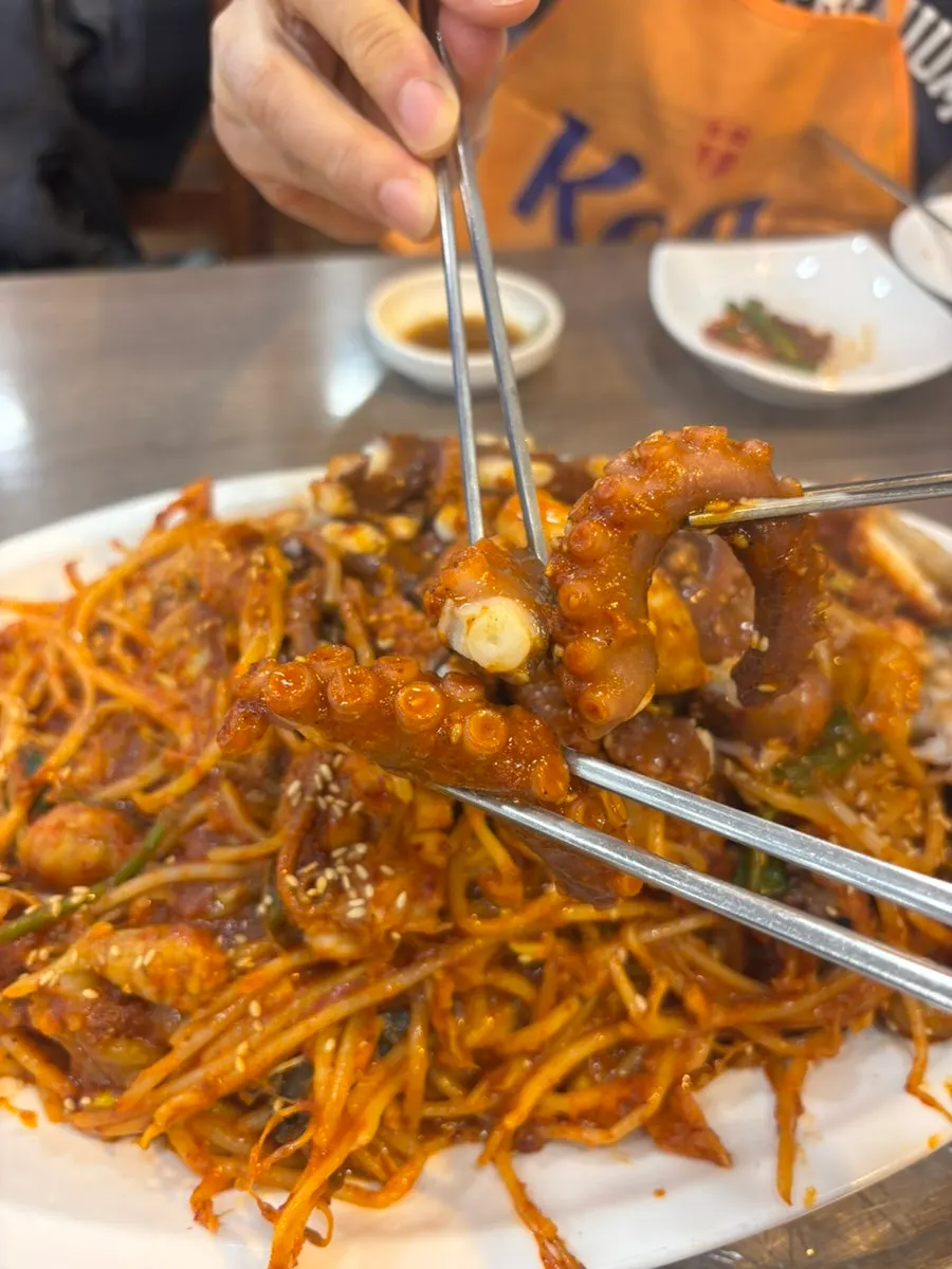 Chewy octopus lifted up with chopsticks