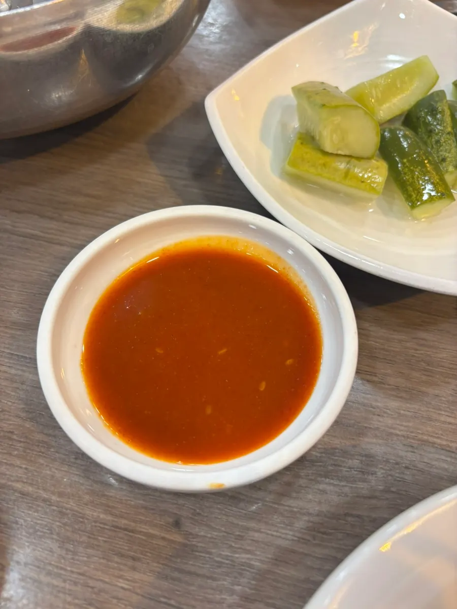 A small dish of vinegar-chili sauce we asked for