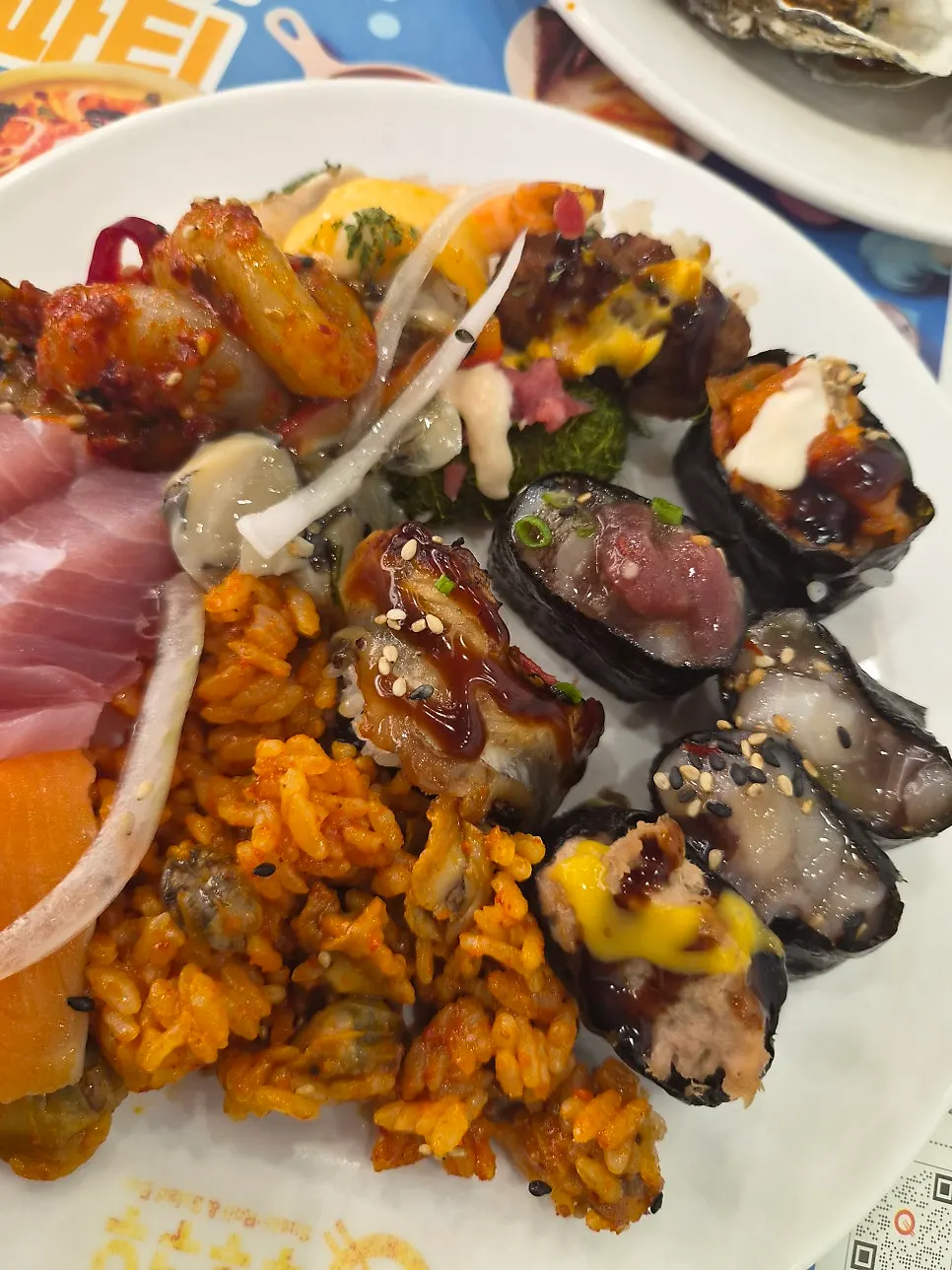Plate piled high with assorted dishes