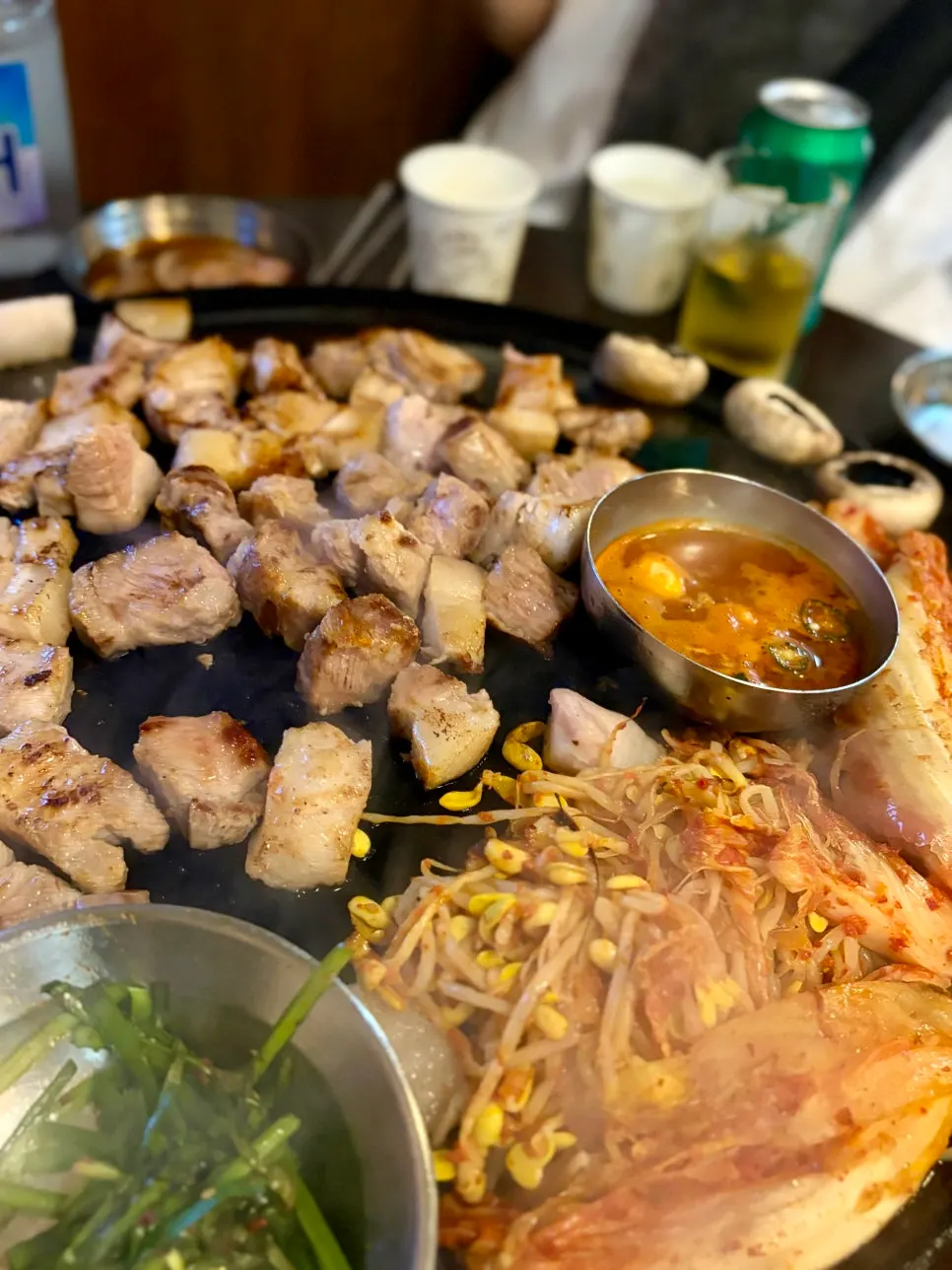 Pork belly browning on the cauldron lid
