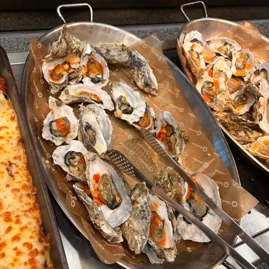A plate of grilled seafood and meat dishes