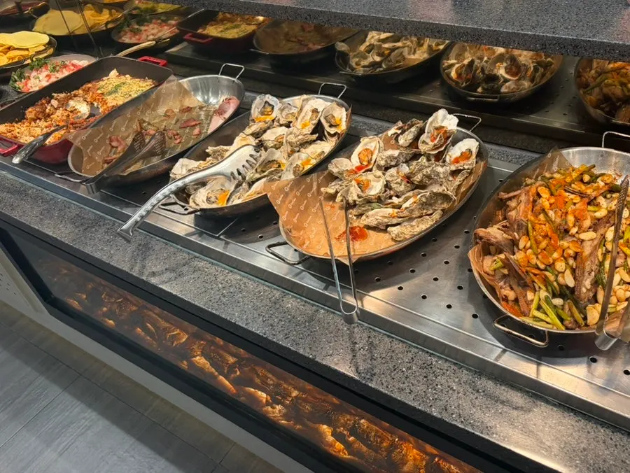 A plate of various dishes from the buffet