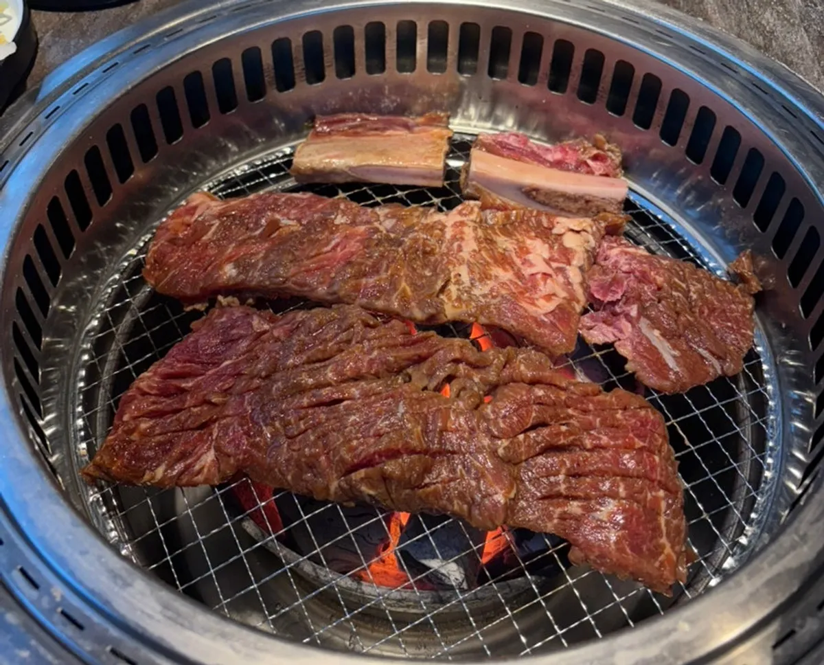 Idong galbi served with Korean side dishes