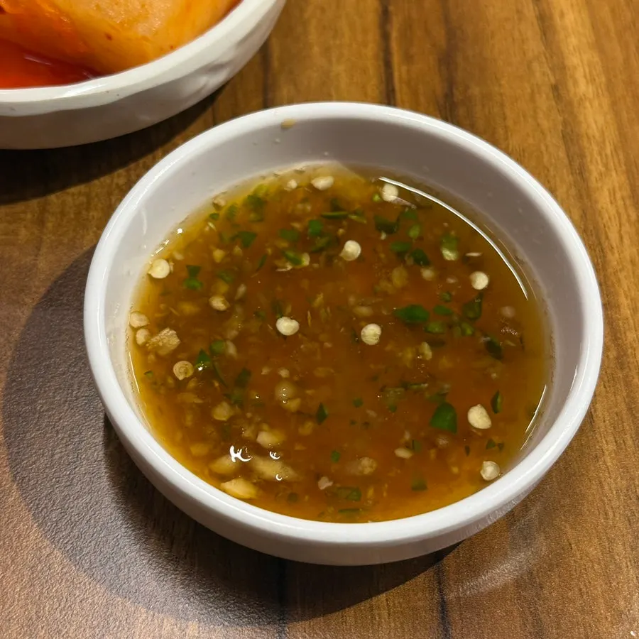 Dipping sauce served alongside the pork belly