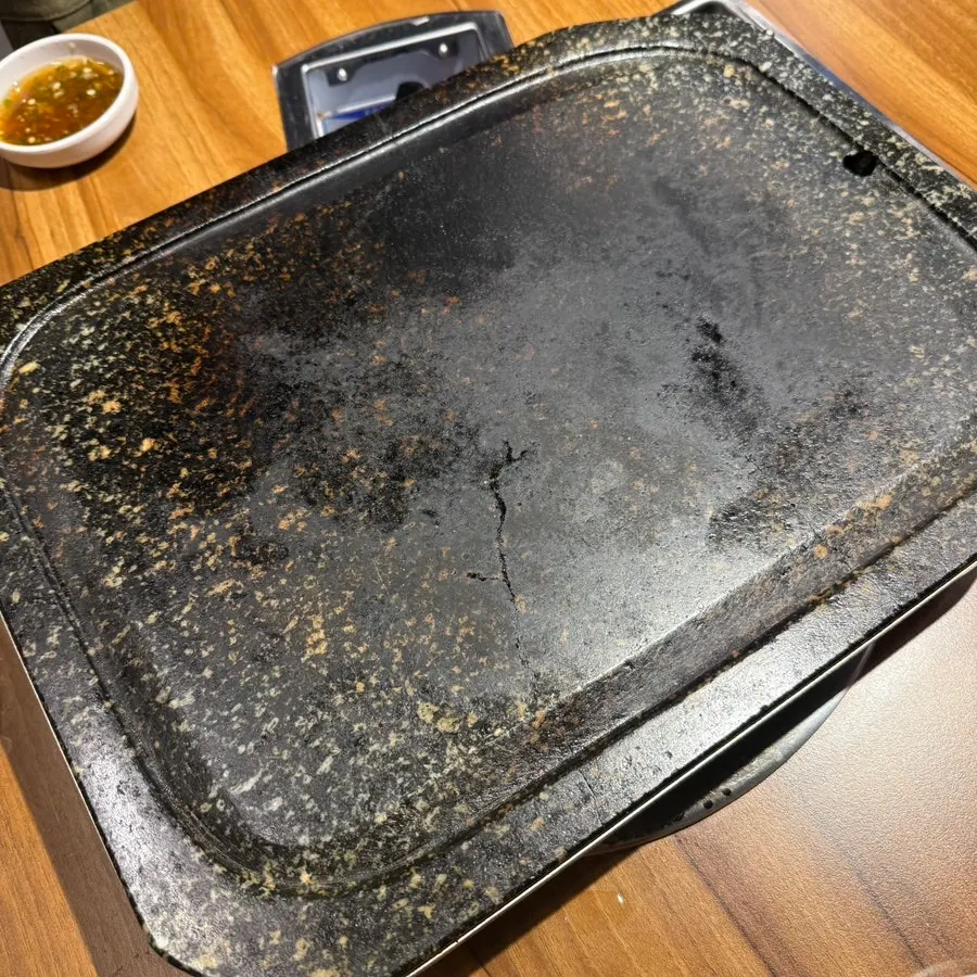 Stone grill plate used for cooking the meat