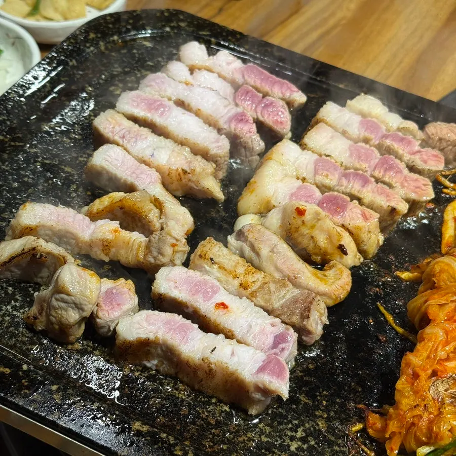 Thick fresh pork belly with the surface torch-seared