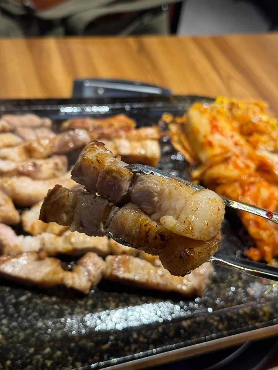 A thick piece of grilled fresh pork belly