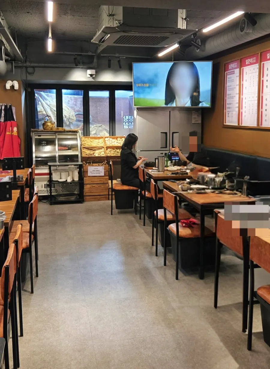 Tables spread widely on both sides of the restaurant