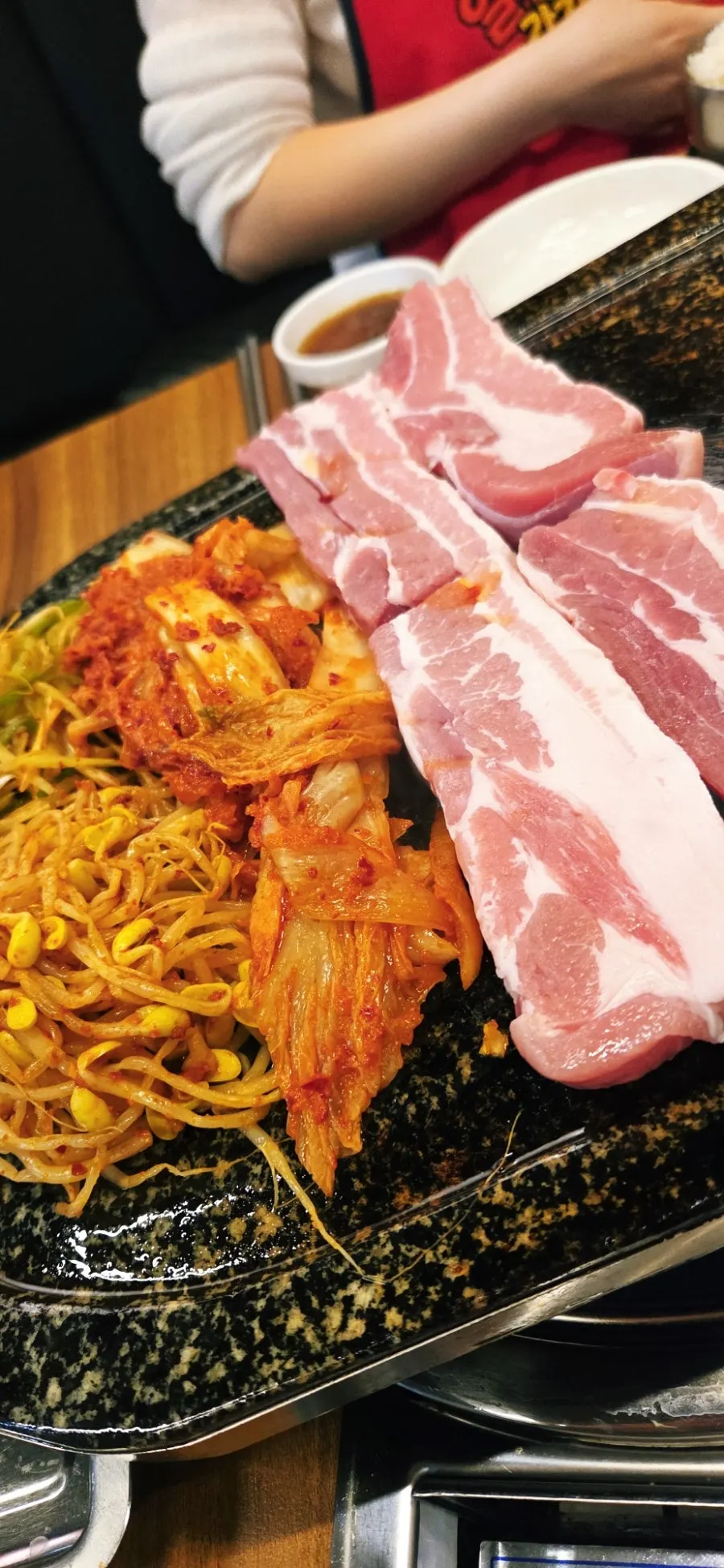 Pork belly table with kimchi and bean sprouts