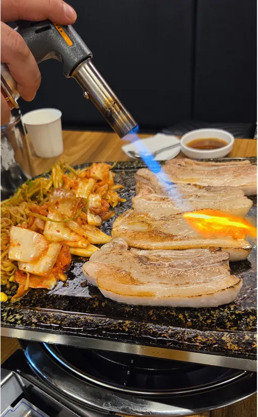 Pork belly placed on the grill