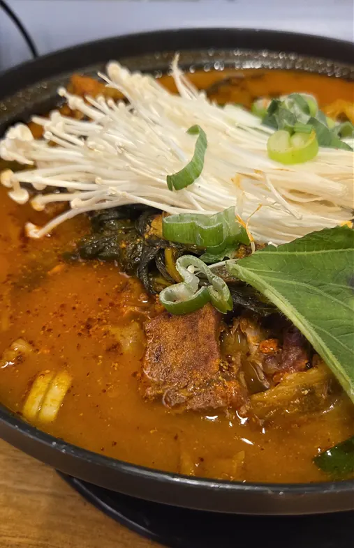 A pot of free gamjatang served with the meal