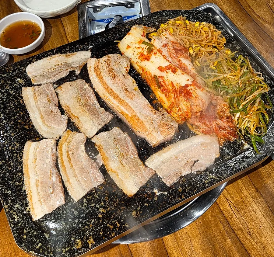 Chilled thin pork belly and thick-cut pork belly with aged kimchi and scallion salad