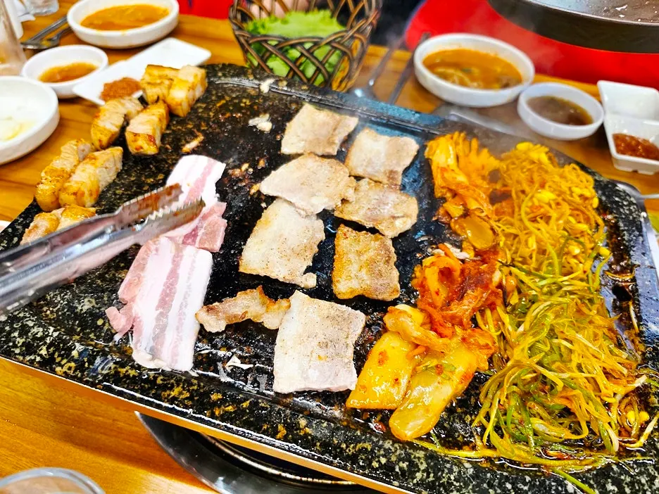 Final table spread of pork belly and gamjatang
