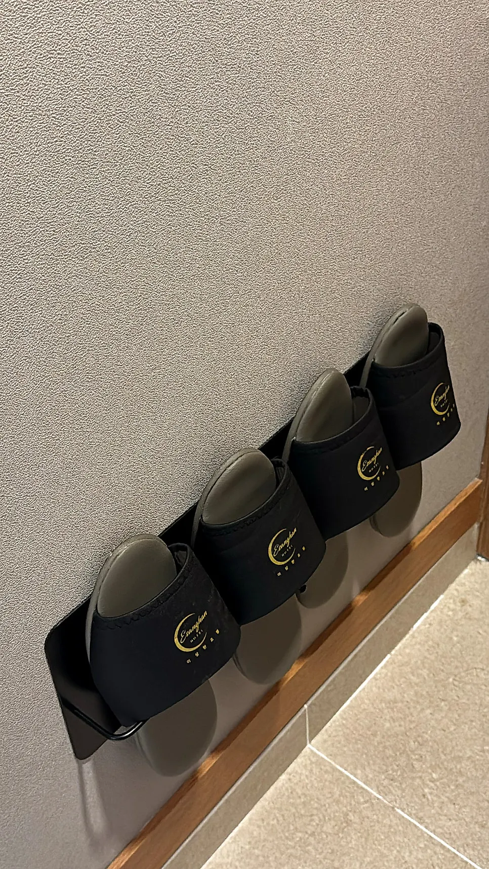Indoor slippers by the entrance of room 301