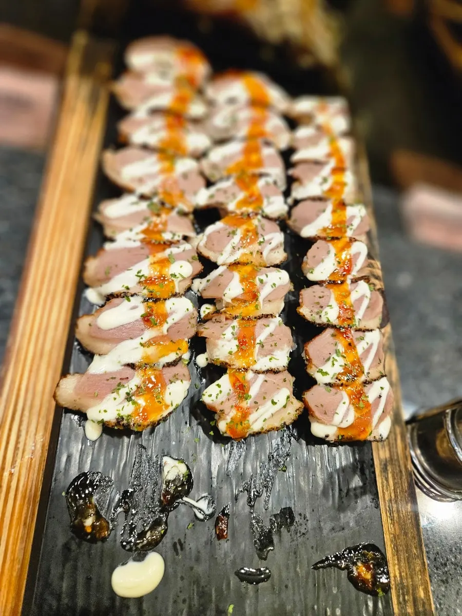 Sushi buffet corner with sushi and rolls on display
