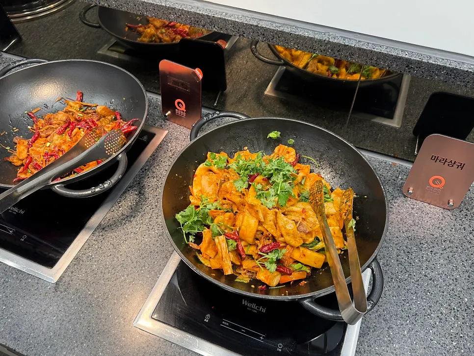 Display of warm dishes including chicken and crab