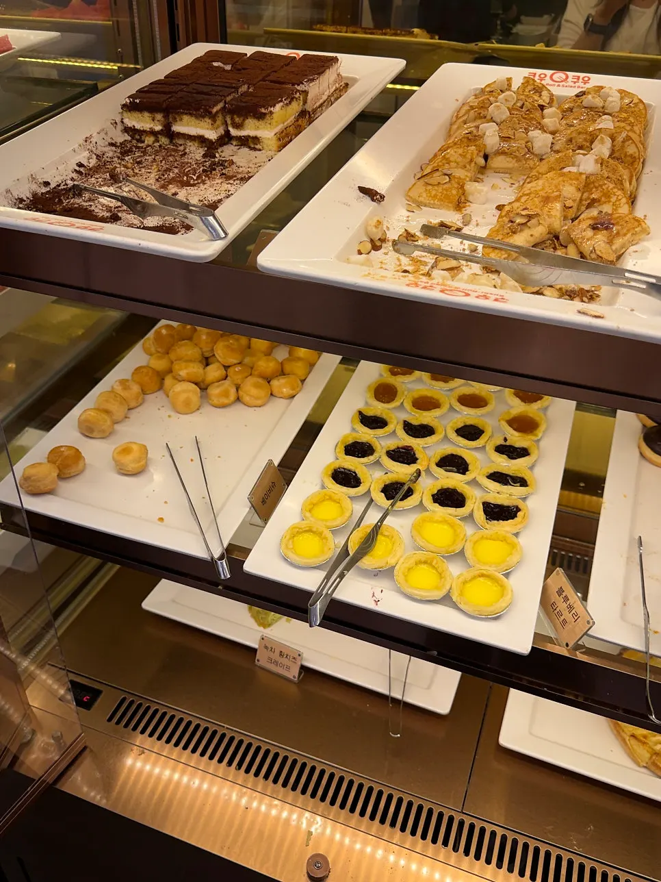 Dessert display with macarons and crepes
