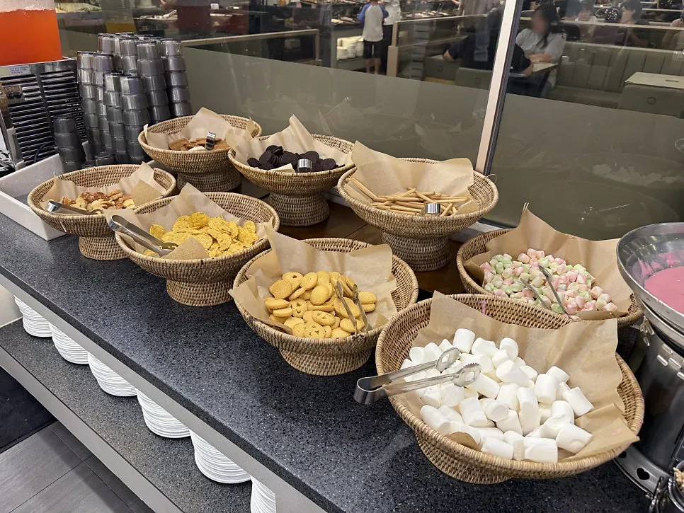 Waffle station with chocolate and strawberry fountains