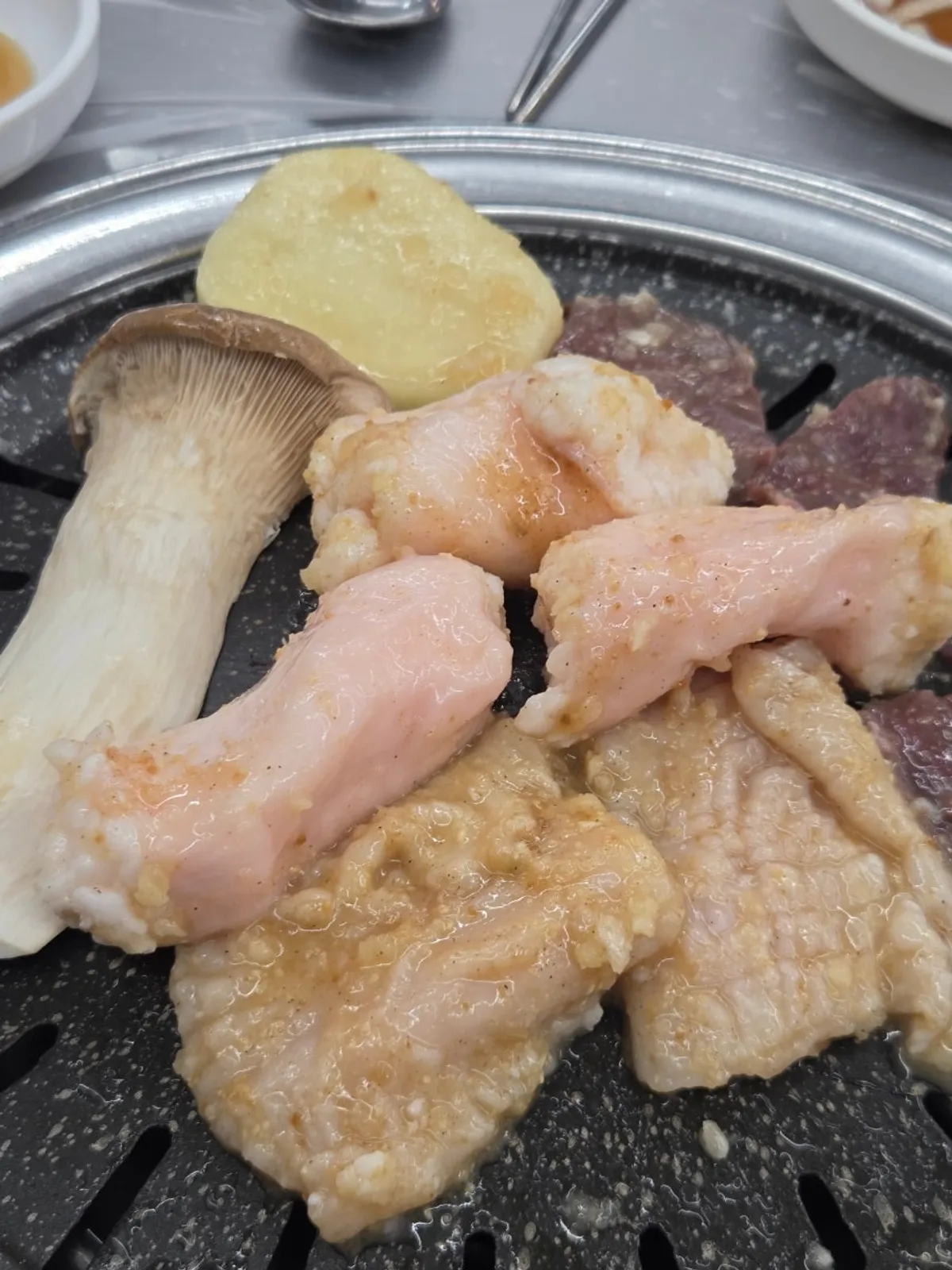 Raw yang gopchang placed on the grill