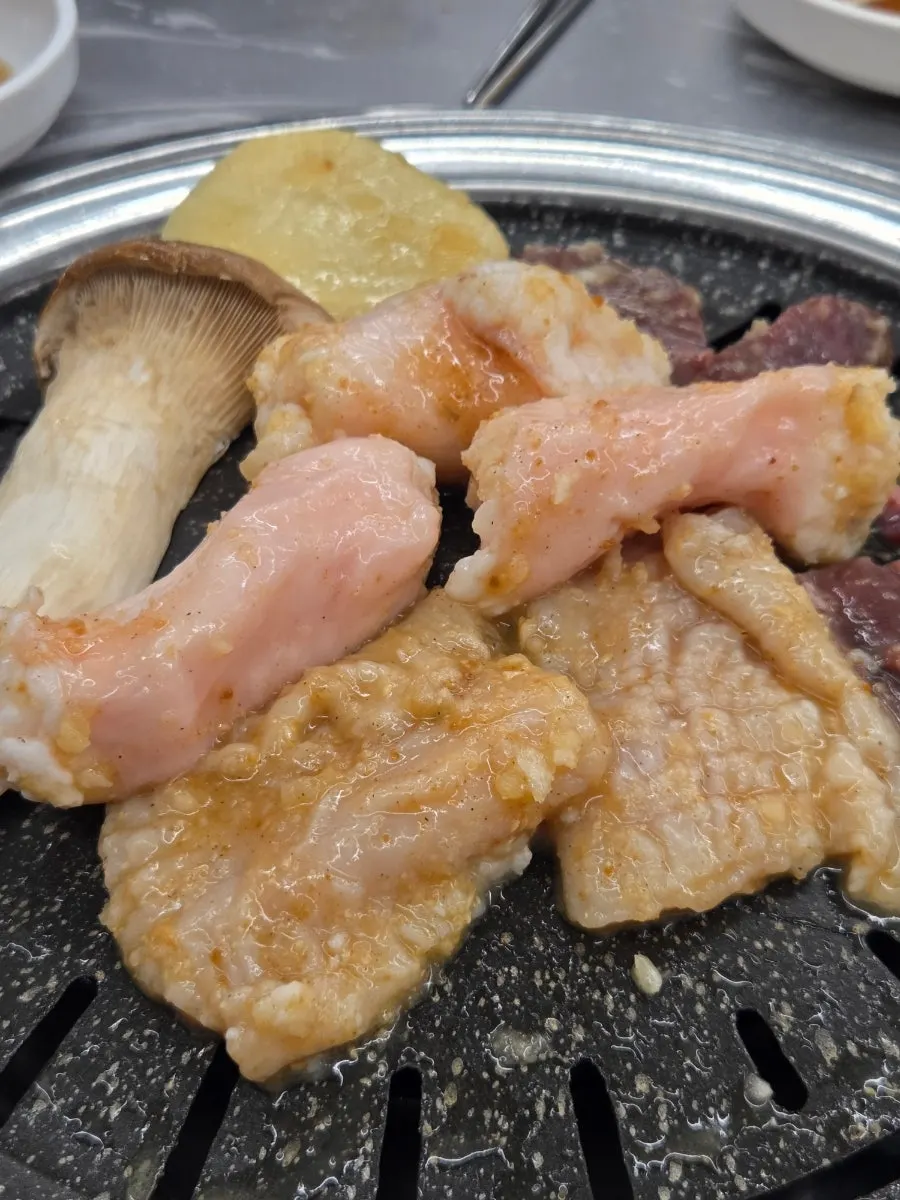 Staff grilling yang gopchang on the pan