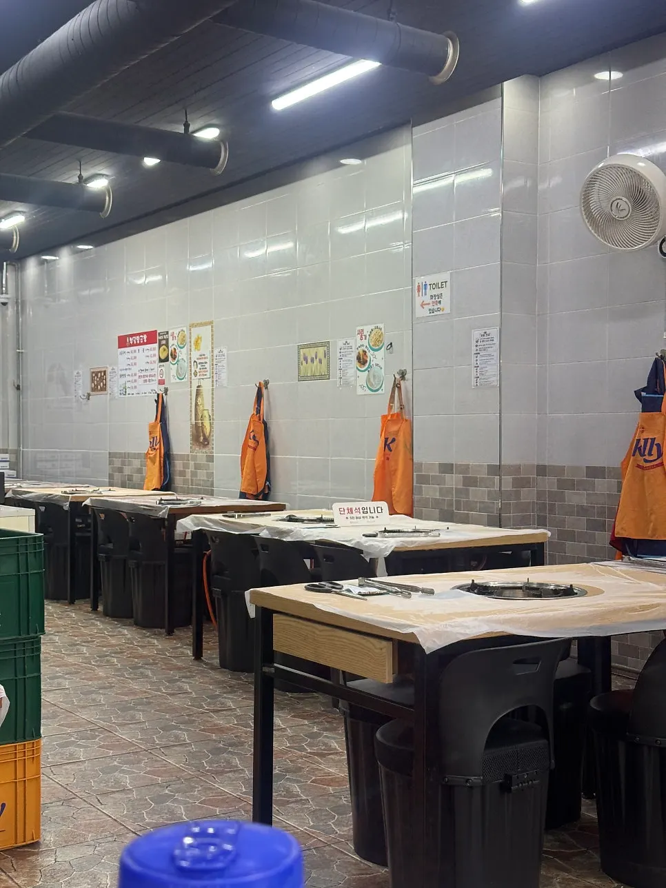Fully booked outdoor plastic tables at Bupyeong Yang Gopchang