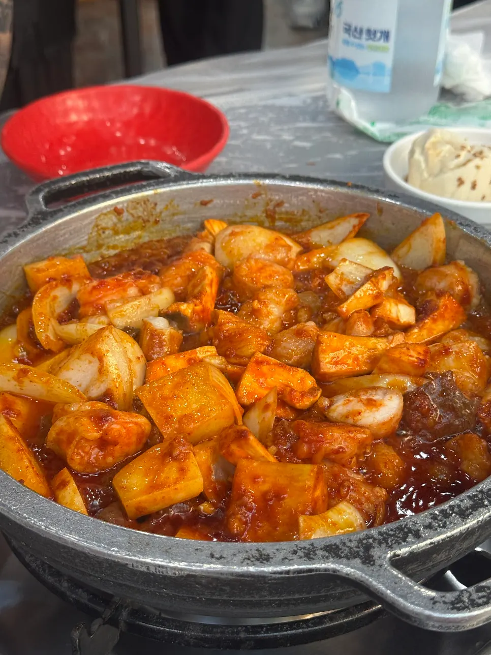 A mountain of fiery red sauced offal