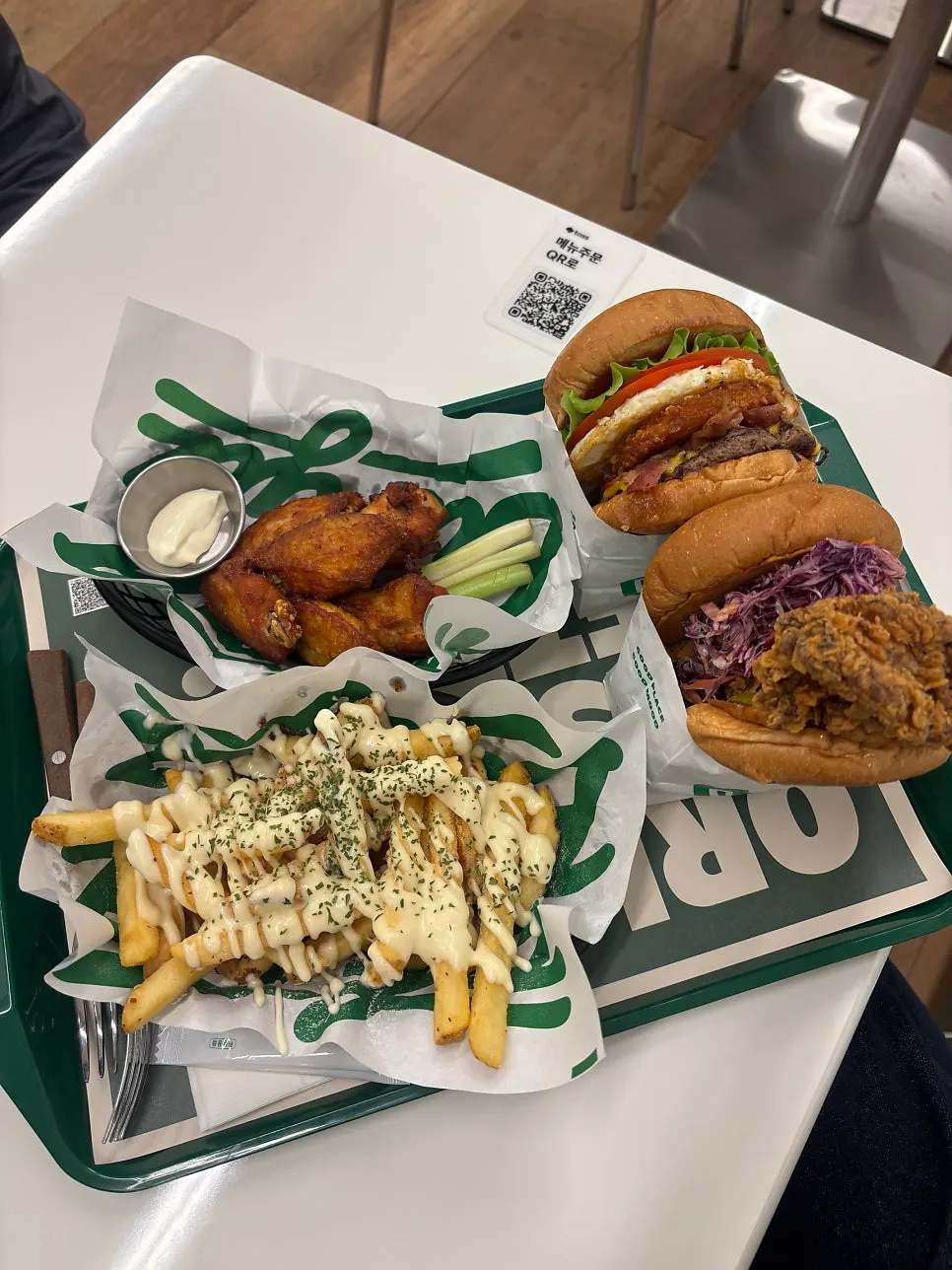 Burgiz burgers and sides set on the table