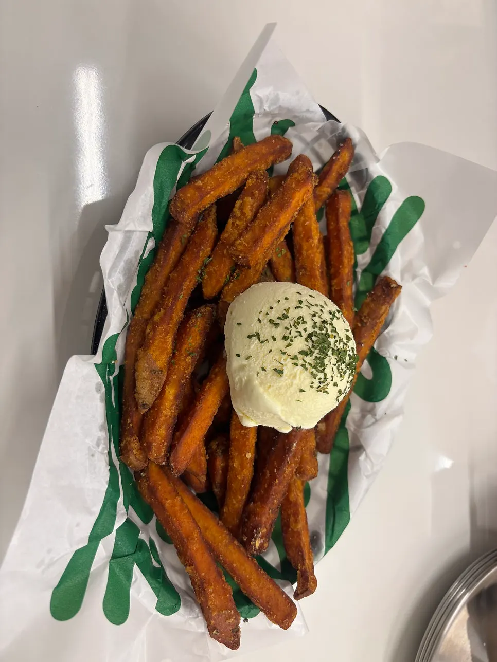 Sweet potato fries topped with vanilla ice cream