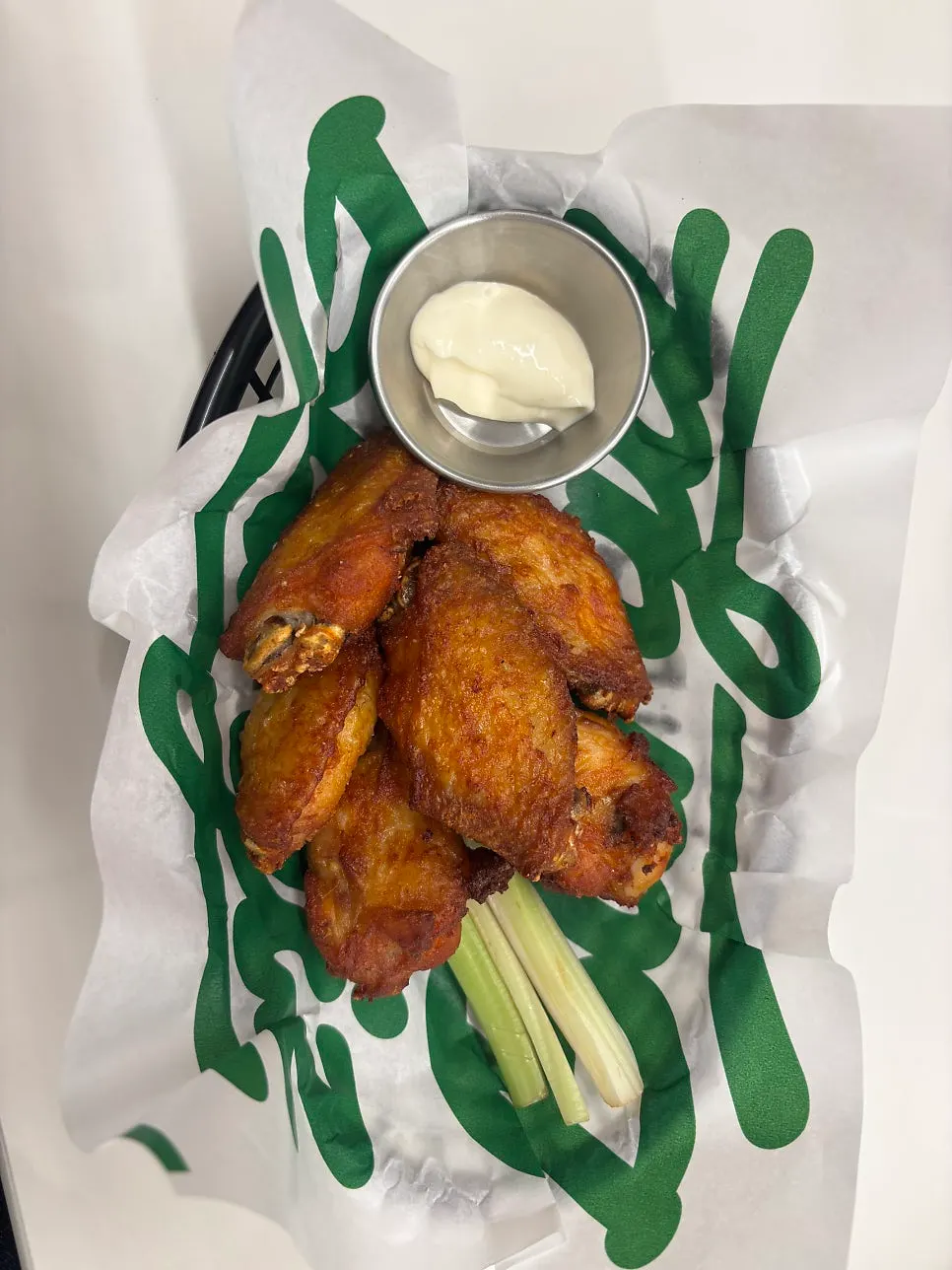 Buffalo wings served with celery sticks