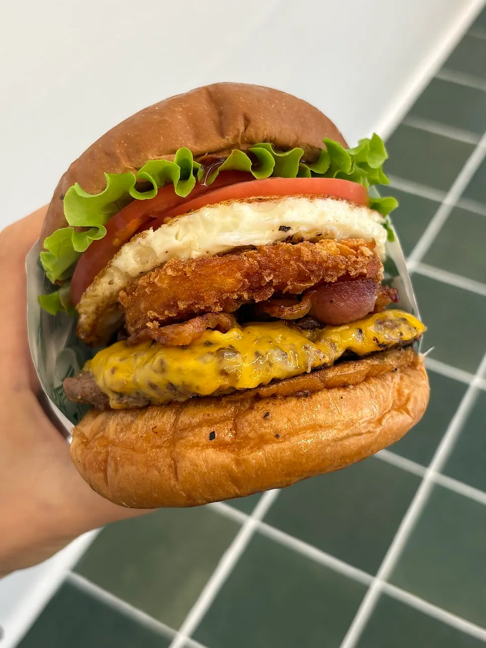 Hangover burger topped with hash brown and fried egg