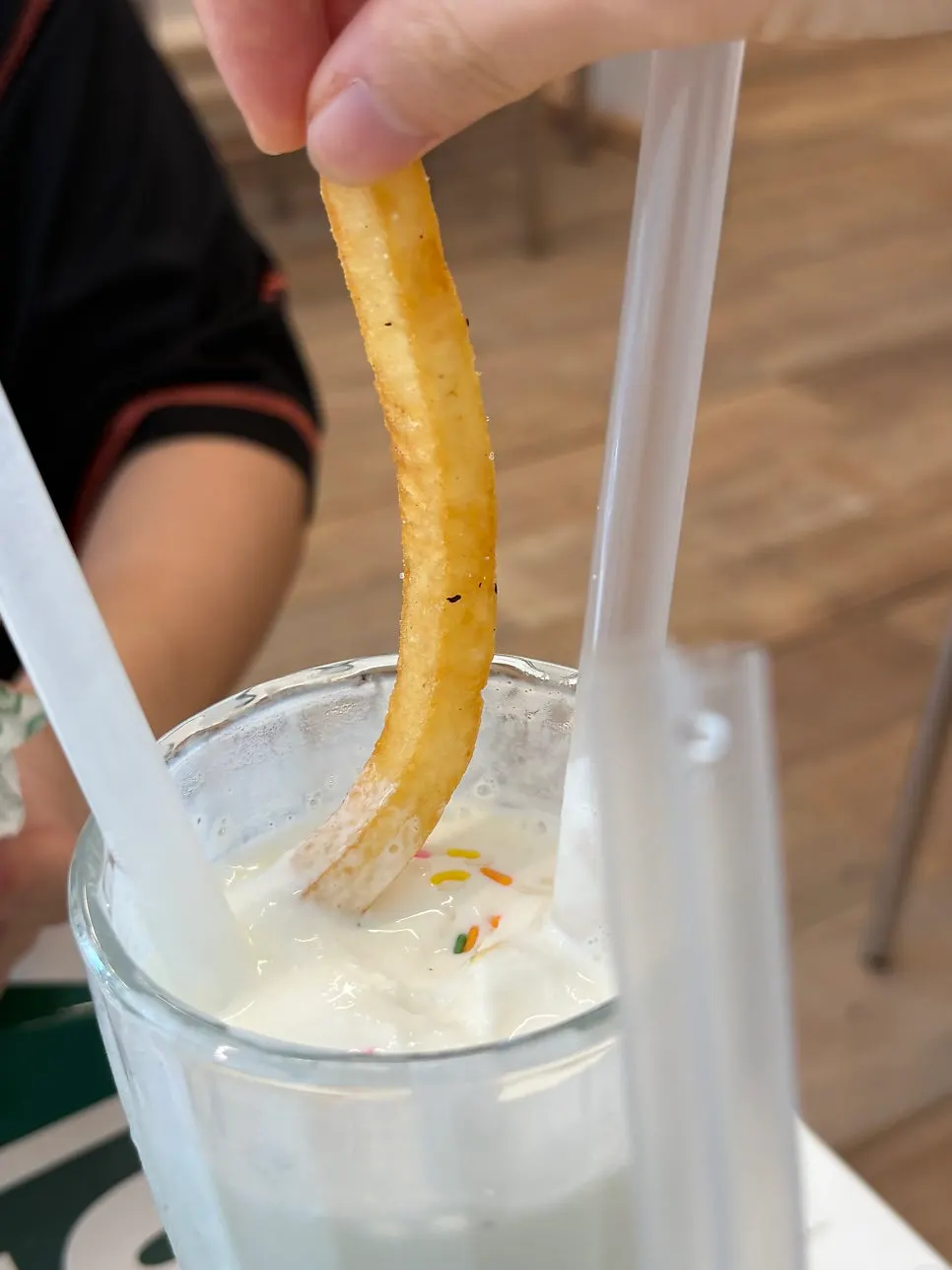 Fries dipped into the milkshake