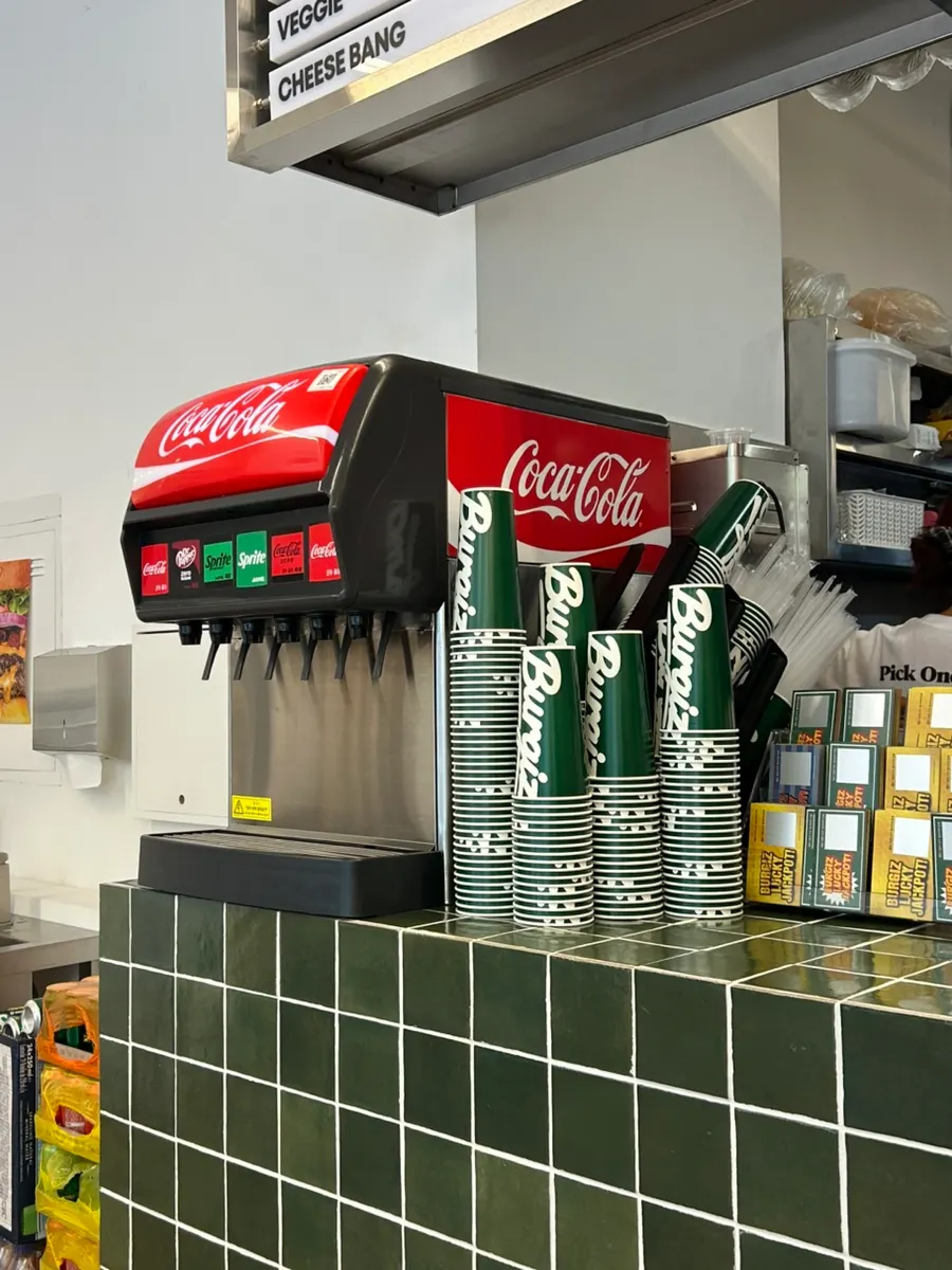 Self-serve drink station with cups of ice