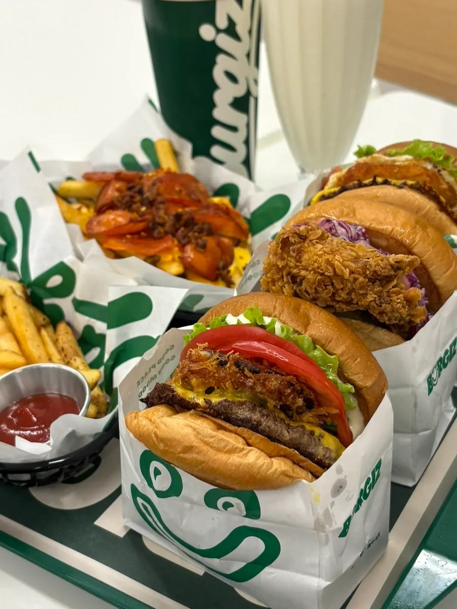 Close-up of a tall Burgiz handmade burger